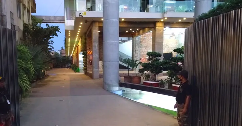 The factory entrance walkway with planted courtyard
